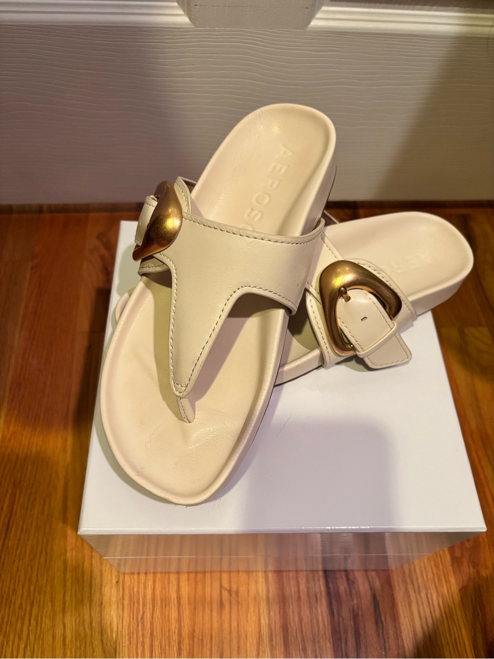 AEROSOLES Ivory Thong Sandals with Gold Buckle Accent